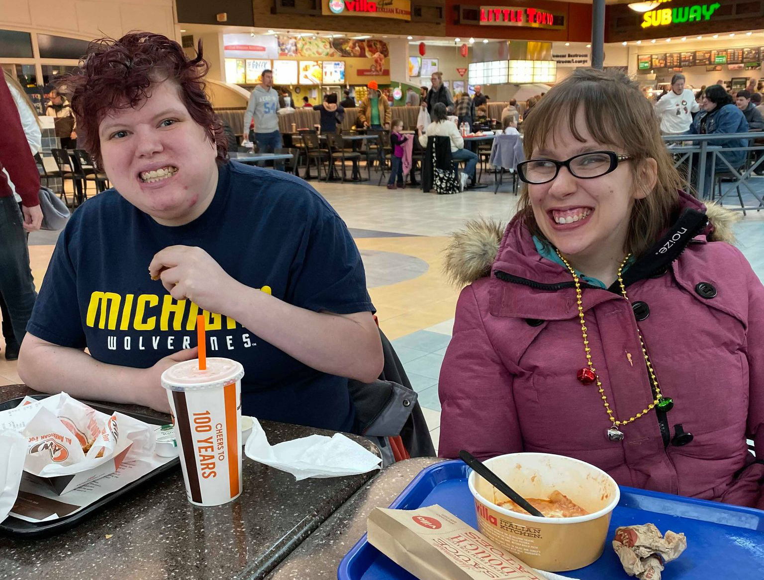 Two female SOMI athletes have lunch together.