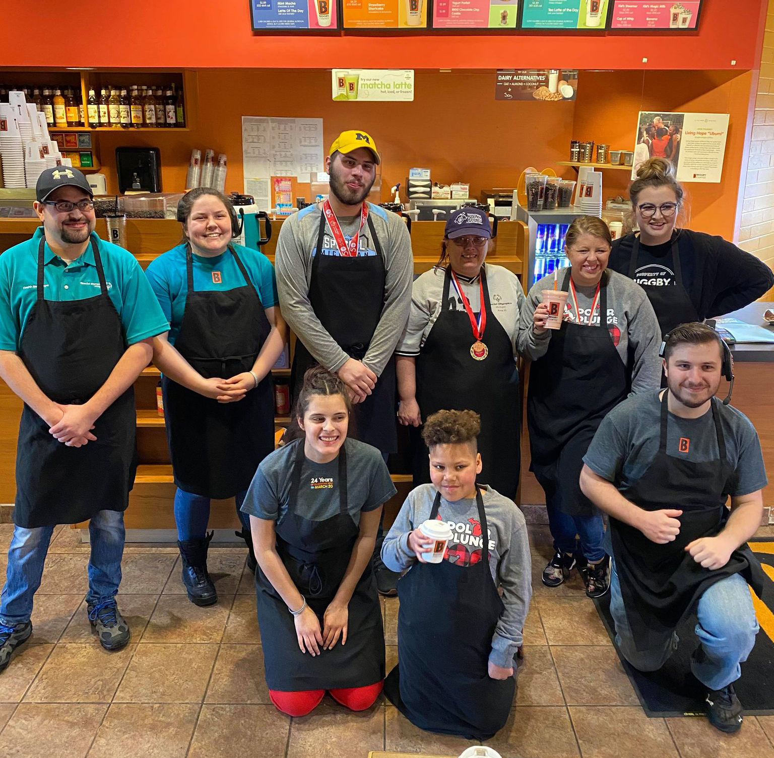 SOMI athletes volunteer at a coffee shop.