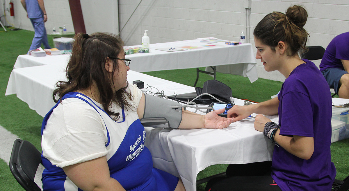 A Special Olympics Michigan athlete has their vitals checked.