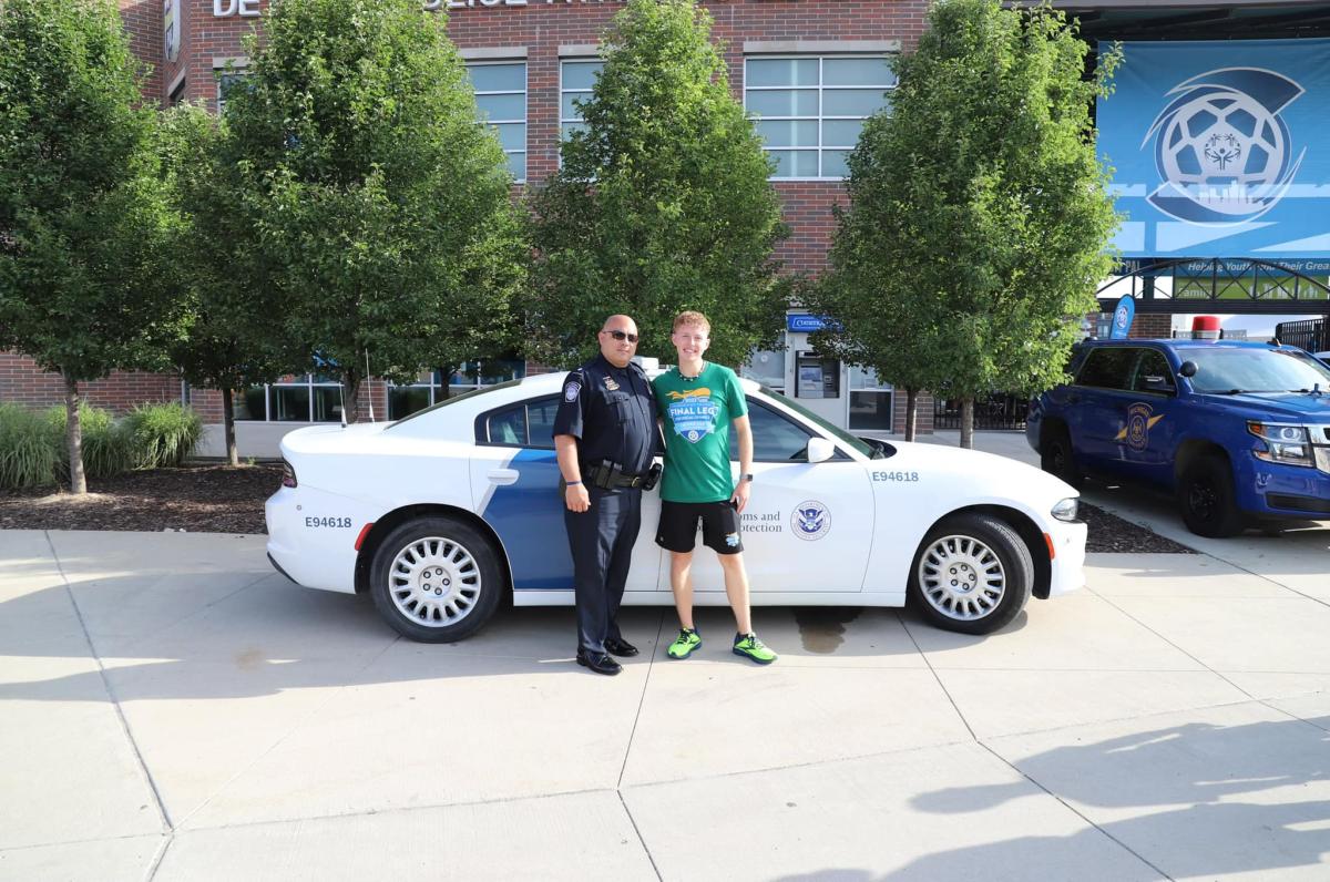 Detroit Police Chief lights cauldron during Special Olympics Opening Ceremony.