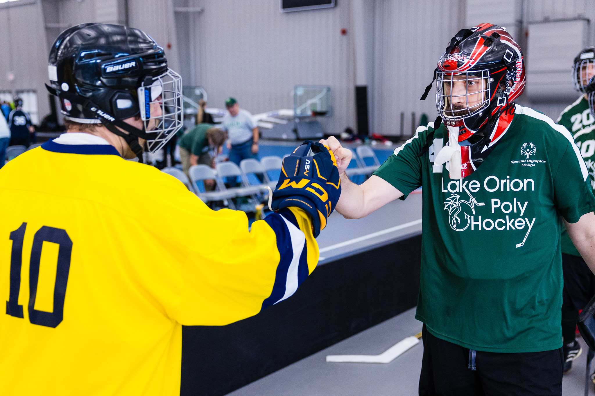Poly Hockey athletes fist bump