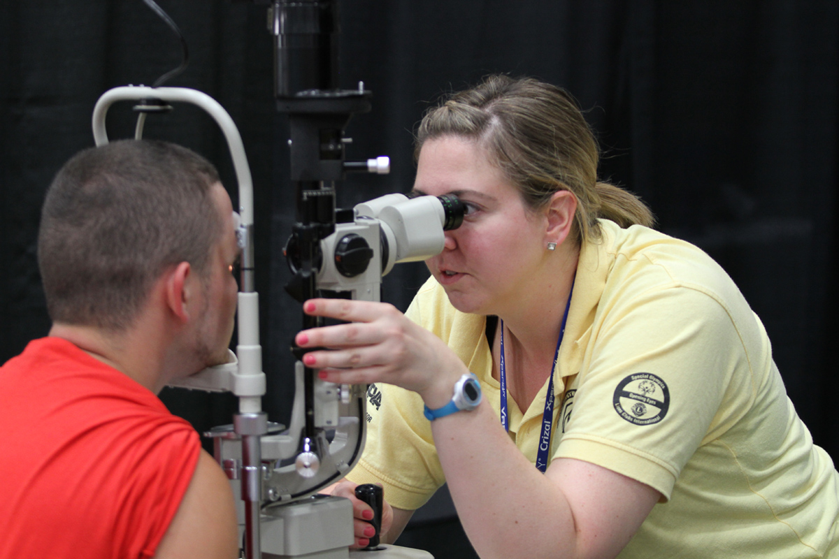 An athlete receives an eye exam.