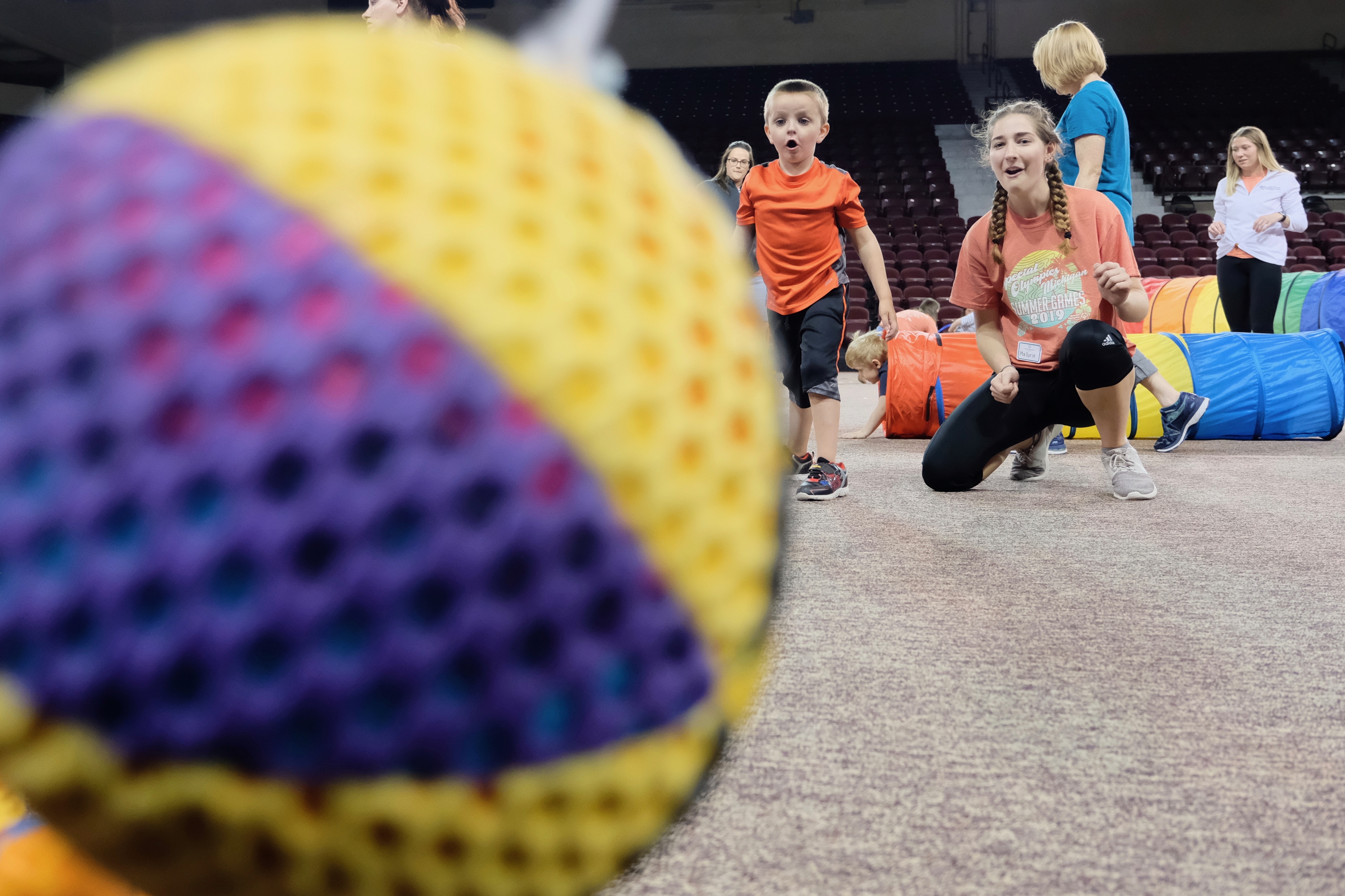 Young athlete rolling a ball