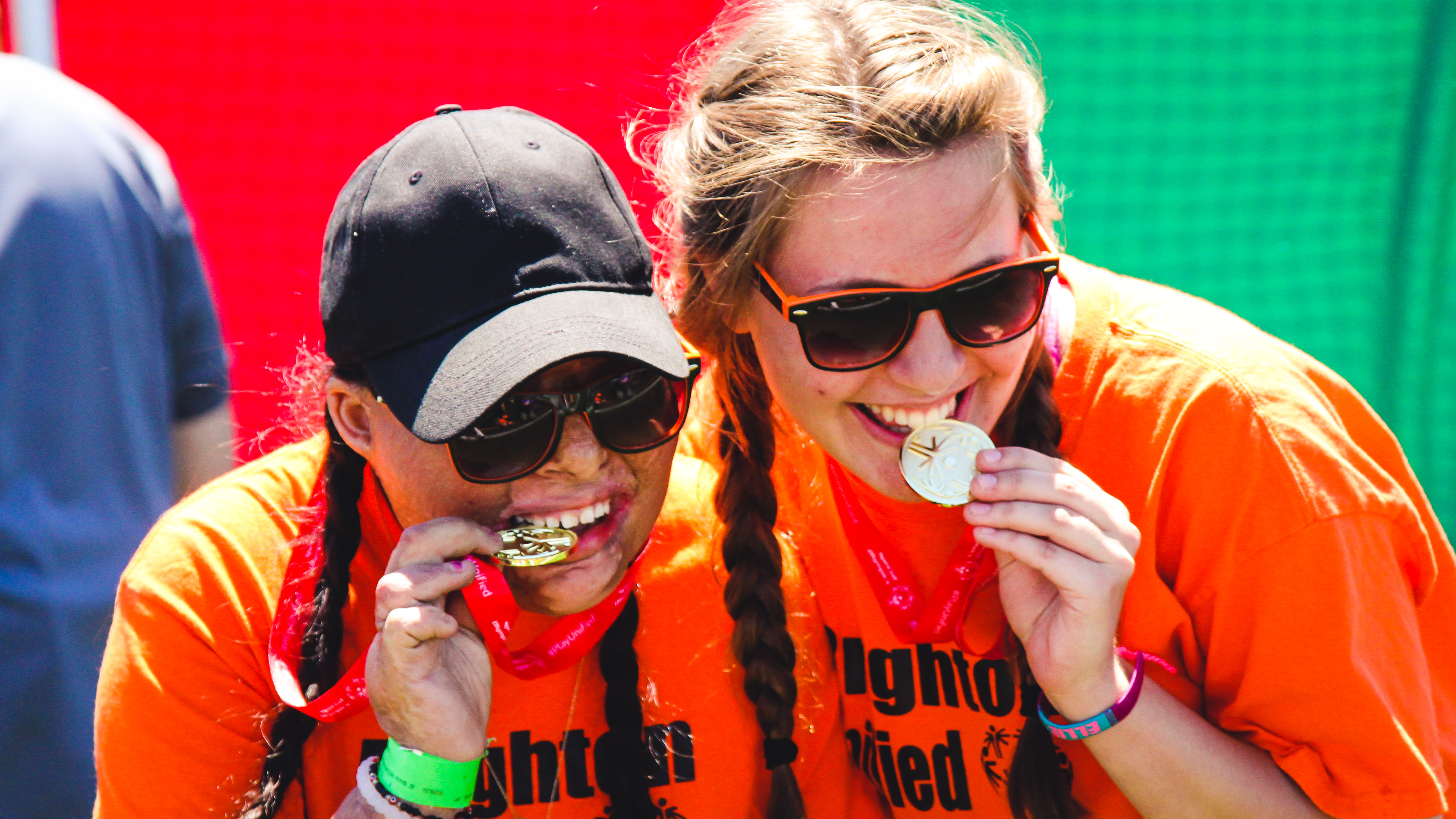 unified athletes celebrating with medals