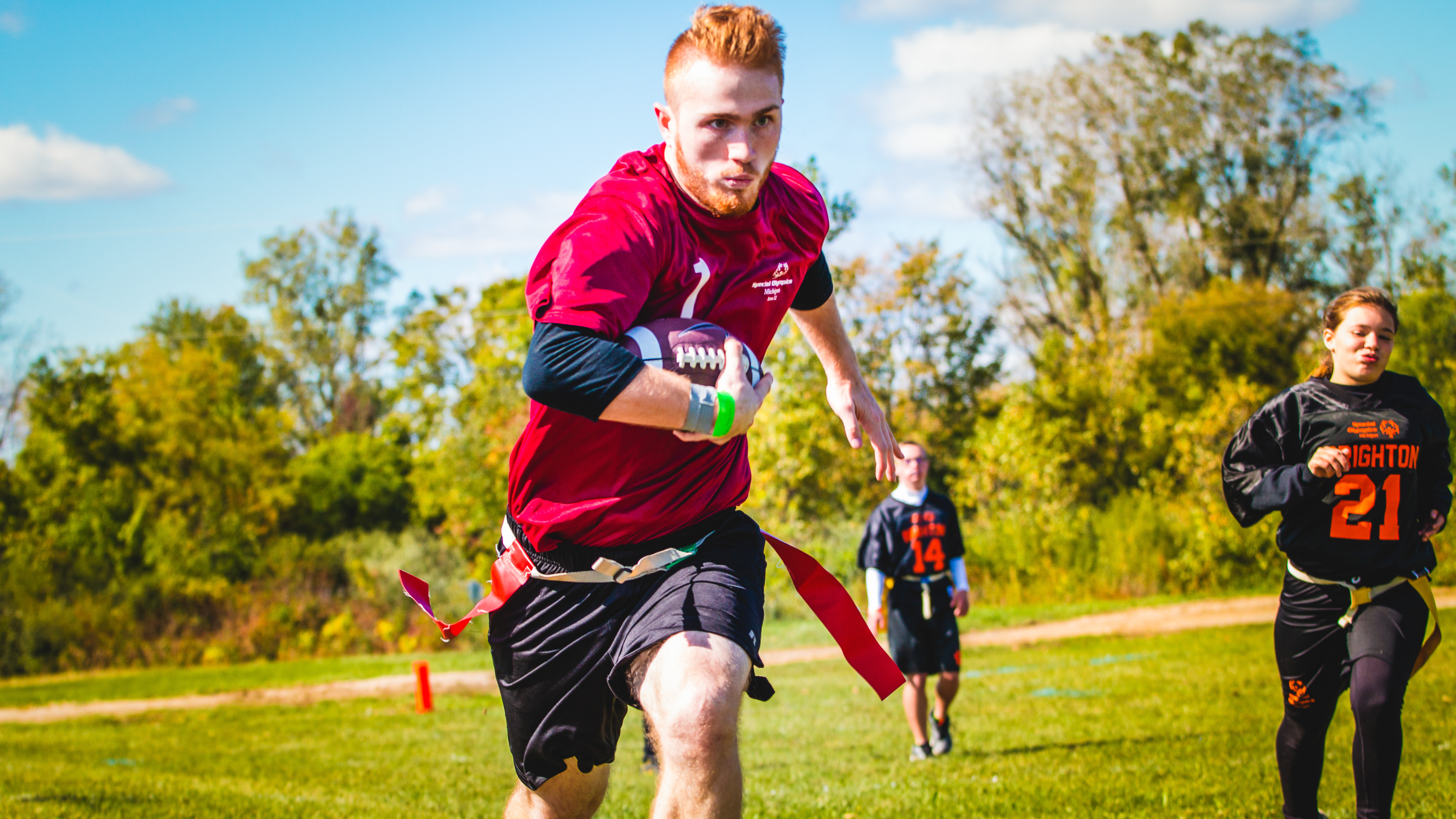 athlete running towards the endzone