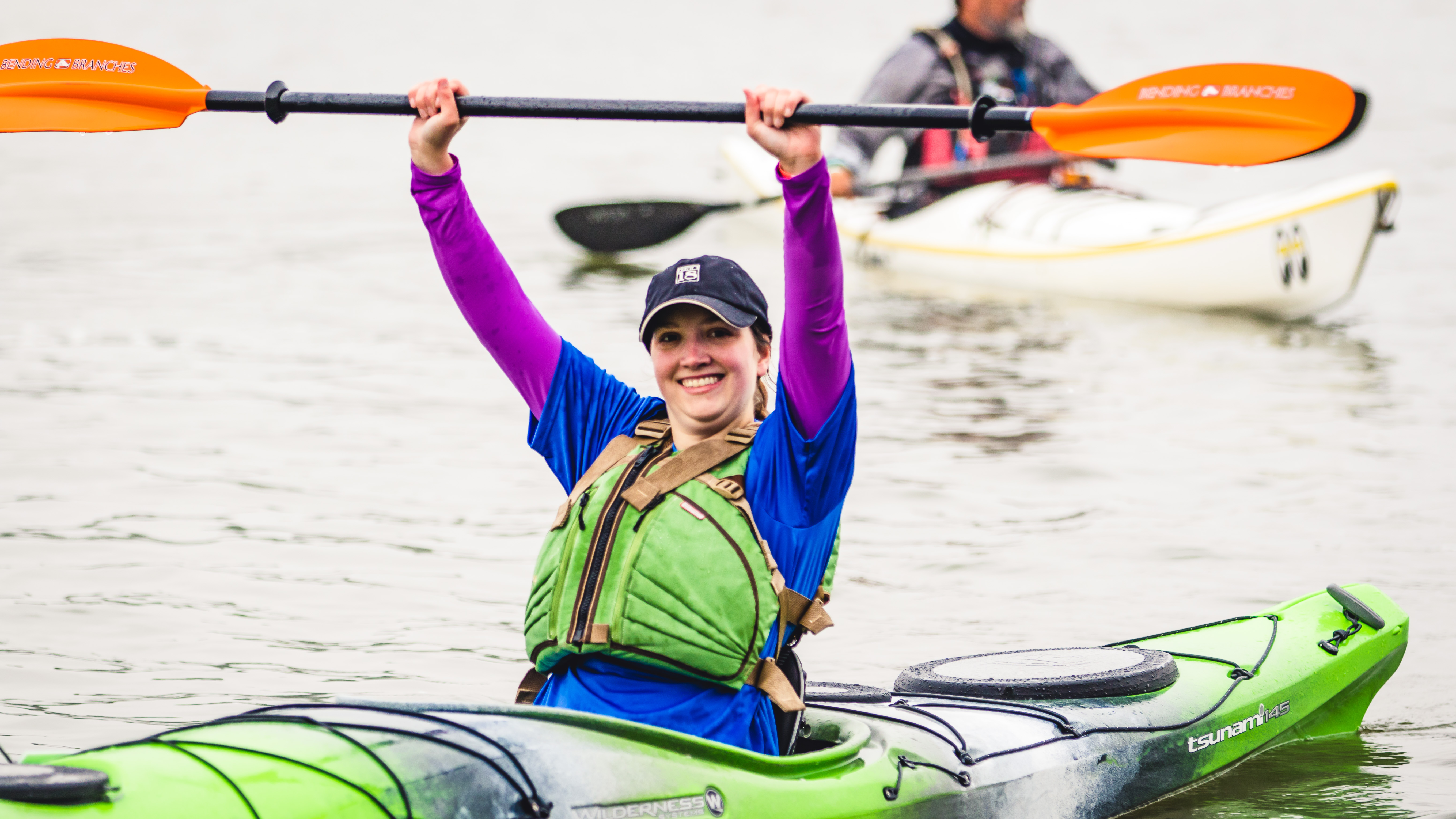 kayaker celebrating