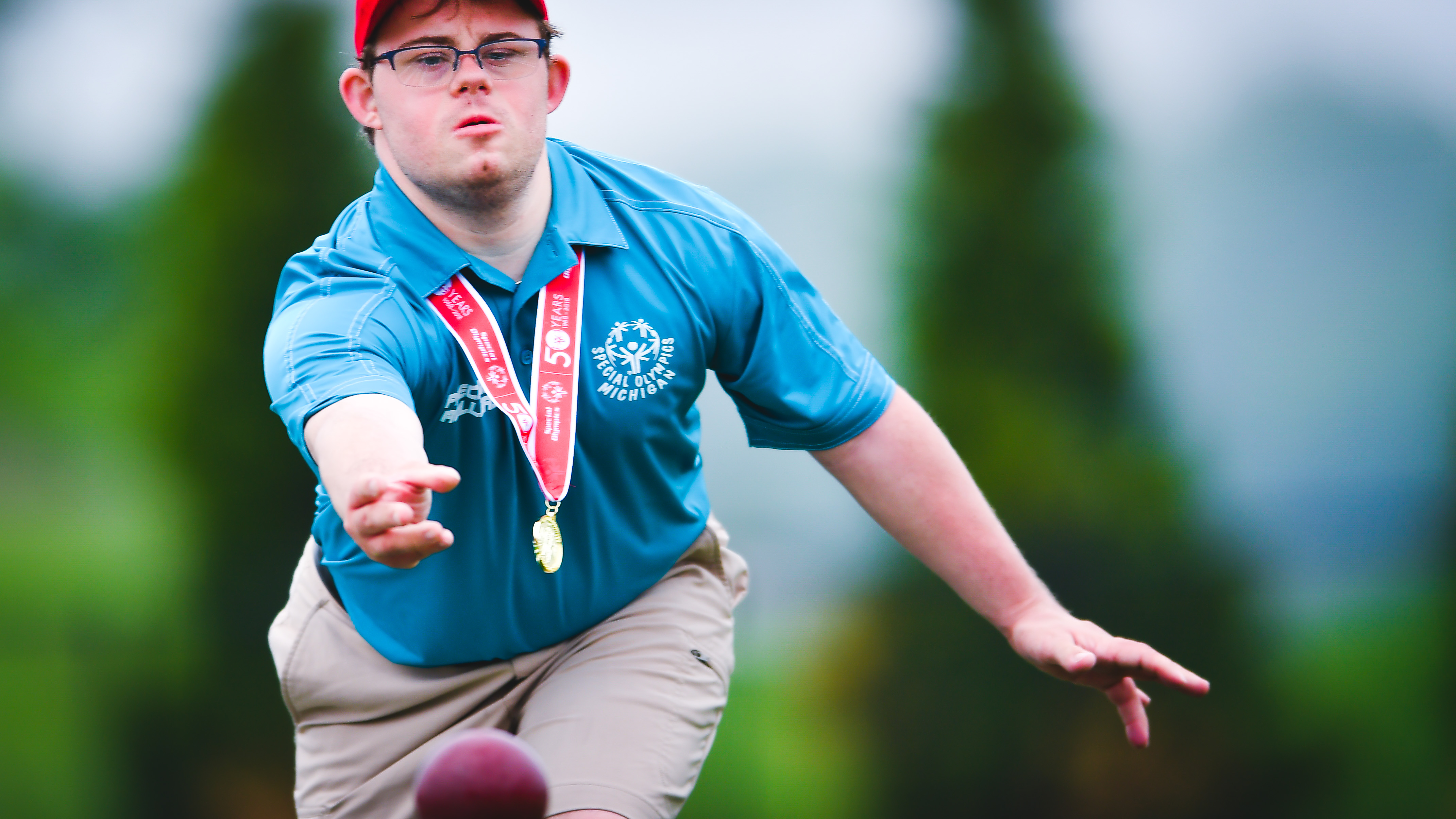 athlete tossing ball