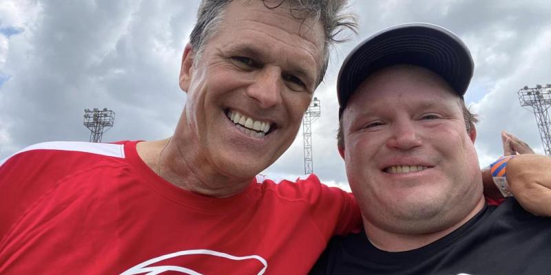 Ben Haack on the pitch with SO Chairman Tim Shriver at Unified Cup.