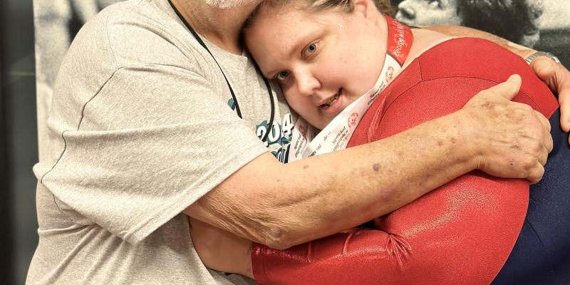 Rachel hugging a family member following competition.