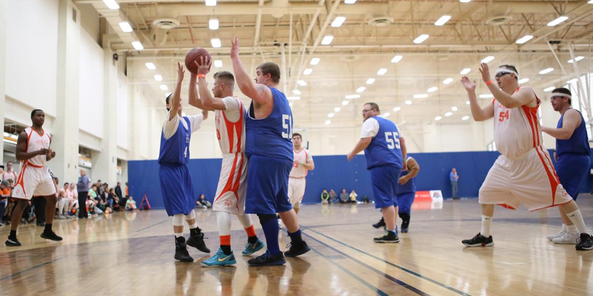 Athletes play basketball at the State Unified Basketball Finals.