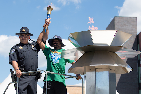 Detroit Police Chief lights cauldron during Special Olympics Opening Ceremonies 