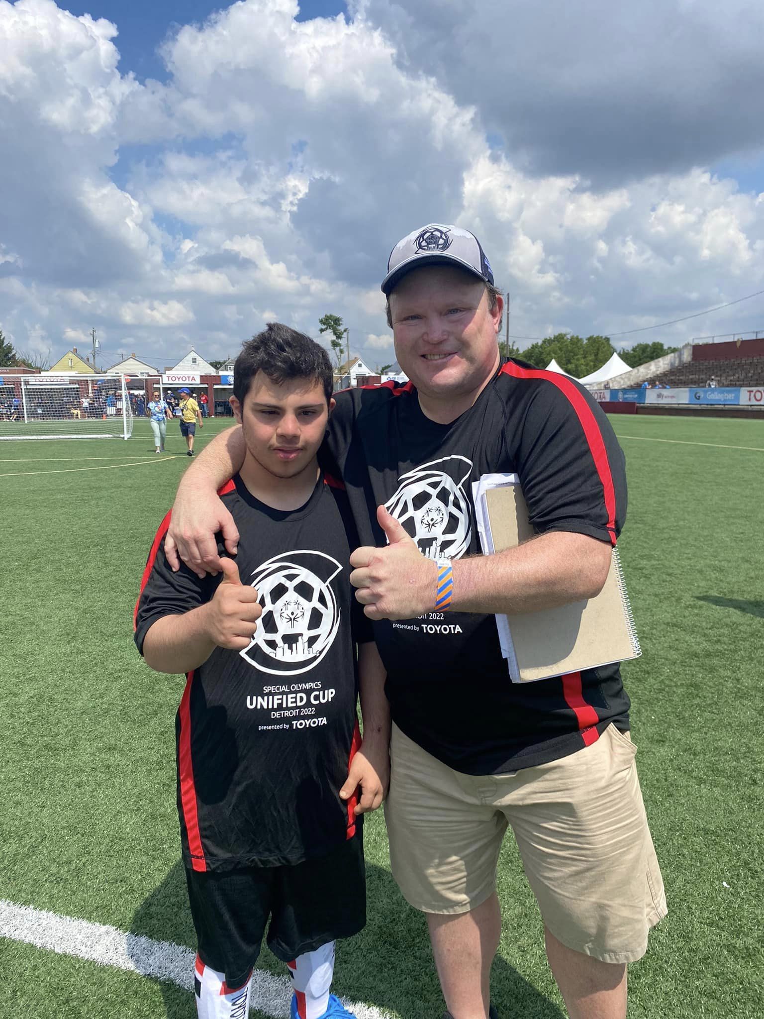 Haack (right) smiles for a photo at the Unified Cup Celebrity Match. 