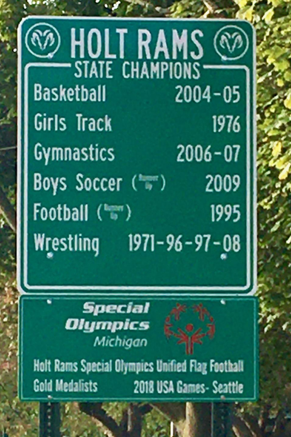 A road sign in Holt commemorates the 2018 USA Games gold medal-winning flag football team